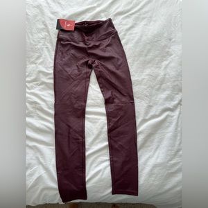 Wine colored faux leather leggings size xs